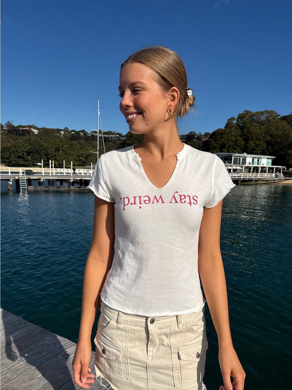 White 'Stay Weird' V‑Neck Graphic Tee